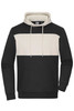 A colour-block hoodie featuring a black lower section and a cream upper panel, with a front pocket and drawstring hood.