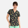 A women's v-neck top featuring a black background with colourful prints of tacos, cacti, and cherries.