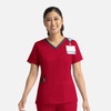 A red women's double V-neck top with a contrasting neckline, featuring a pocket and a badge holder.
