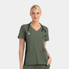 A women's mock wrap top in olive green with contrast black panels, featuring a patch pocket and a stethoscope.