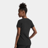 A black women's dolman top featuring a notched neck and short sleeves, displayed from a side angle with a model.