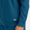 A full zip bomber jacket in a deep blue colour with a ribbed cuff and side pockets. Features a logo on the front.