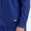 A men's full zip bomber jacket in blue featuring a ribbed collar and cuffs, with a logo on the side.