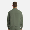 A mens full zip bomber jacket in olive green, featuring a simple design and a branded logo on the back.