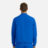 A man in a blue full zip bomber jacket, viewed from the back, featuring a subtle branding logo.