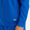 A full zip bomber jacket in vibrant blue featuring a ribbed collar and cuffs, with a small logo on the side.