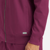 A maroon men's bomber jacket with a full zip, featuring a logo and side pockets.