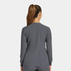 A women's round neck snap jacket in grey, featuring long sleeves and a plain design with a logo.
