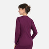 A women's round neck snap jacket in deep purple, featuring a sleek design and a subtle logo.