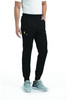 A pair of black joggers featuring a half elastic waistband and side pockets, worn with grey sneakers.