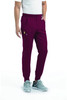 A pair of men's joggers in burgundy with a half elastic waistband and pockets, paired with grey sneakers.