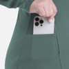 A green women's hooded zip front jacket with a pocket holding a smartphone. The jacket has a logo on it.