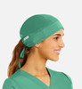 A unisex scrub cap in vibrant green, featuring a logo and designed for comfort and fit.