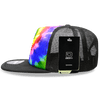 A high-profile structured trucker hat featuring a vibrant tie-dye pattern in multiple colours with a black mesh back.