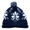 A navy beanie with a white snowflake pattern and a pompom on top, featuring a folded brim.