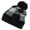 A black and grey plaid beanie with a pom pom on top, featuring a textured pattern and a rolled cuff.