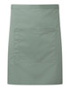 A mid-length pocket apron in a soft green shade, featuring a central pocket and branding.