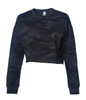 A women's cropped crew sweatshirt in a dark camouflage pattern with long sleeves. It features a logo.