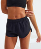A pair of black running shorts with an elastic waistband, showcased on a model's lower body.