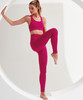 Seamless 3D Fit Sport Sculpt Leggings in vibrant pink, paired with a matching crop top, displayed in a dynamic pose.