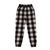Comfy flannel jogger pants in a black and cream checked pattern, featuring an elasticised waistband and fitted cuffs.