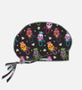 A printed unisex bouffant cap featuring a black background with vibrant sugar skull designs in various colours.