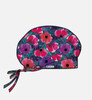 A printed unisex bouffant cap featuring a floral design with purple, pink, and red flowers. It has a drawstring for adjustment.