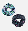 A duo set of printed scrunchies in floral and abstract designs, featuring shades of blue, green, and pink.