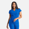 A blue banded v-neck top with short sleeves, featuring a logo on the chest, worn by a smiling woman.