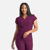 A stylish, short-sleeved banded V-neck top in a rich burgundy colour, featuring a logo on the side.