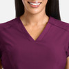 A V-neck top in a rich plum colour, featuring short sleeves and a smooth, comfortable texture.