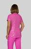 A pink printed top with a shiny finish, featuring a floral pattern, paired with matching pink trousers.