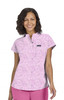 A pink floral short-sleeved top with a collar, featuring a small pocket and a logo on the front.