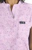 Ari Top (Print) in a pink, speckled pattern with a small pocket and branding tag.