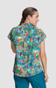 A short-sleeved women's top featuring a vibrant, multicoloured print with various characters and patterns.