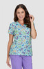 A floral print scrub top featuring a variety of colourful butterflies on a light blue background, with a V-neck design.
