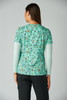 A printed green top featuring floral and animal patterns, designed with short sleeves and a round neckline.