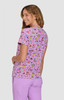 A lilac patterned top featuring a playful design with various colourful illustrations. It has a round neck and short sleeves.