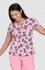 A pink top featuring a playful print of cats and bows, paired with matching pink trousers. The design is vibrant and fun.