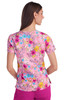 A floral print top featuring a vibrant mix of pink, blue, and yellow colours. It has a logo on the back.