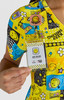 A colourful, patterned top featuring various smiley faces in yellow, with a name badge attached.