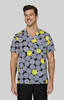 A printed grey top featuring a pattern of smiling yellow and grey faces, worn by a man. The top has a logo.