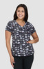 A top featuring a multicoloured pattern of cartoon cats on a dark background. It has a V-neck and short sleeves.