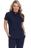 A navy blue medical scrub top worn by a model, featuring a collar and two front pockets. The top is paired with matching pants.