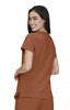 A woman is wearing a brown Sari Top, shown from the back, with a relaxed fit and short sleeves.