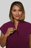 A short-sleeve women's top in a rich plum colour, featuring a zip neck and a small logo on the chest.
