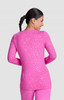 A pink long-sleeved top with a speckled pattern, featuring a round neckline and a fitted silhouette.