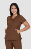 A brown medical top with a relaxed fit, featuring a V-neck and pockets, worn by a smiling model.