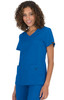 A model wearing a bright blue scrub top with two pockets and a logo on the sleeve.