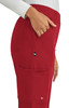 A pair of red boot cut pants featuring pockets and a small logo on the side.